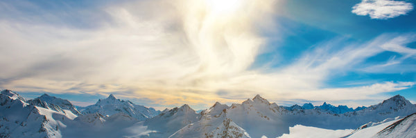 panoramic-canvas-print-over-the-snowy-peaks-panorama